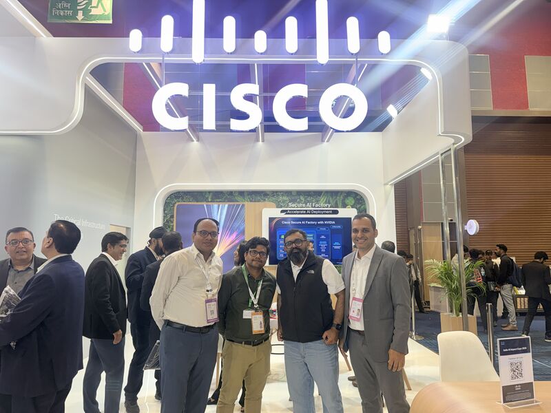 A KissanAI booth conversation at the AI Impact Summit, with industry partners walking through the live Dhenu Platform demo.
